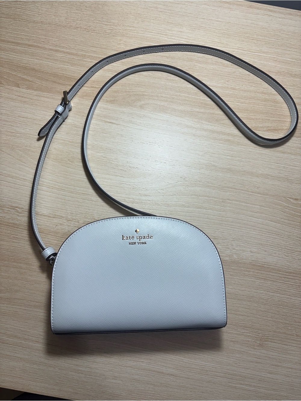 kate spade cream dome crossbody with gold logo